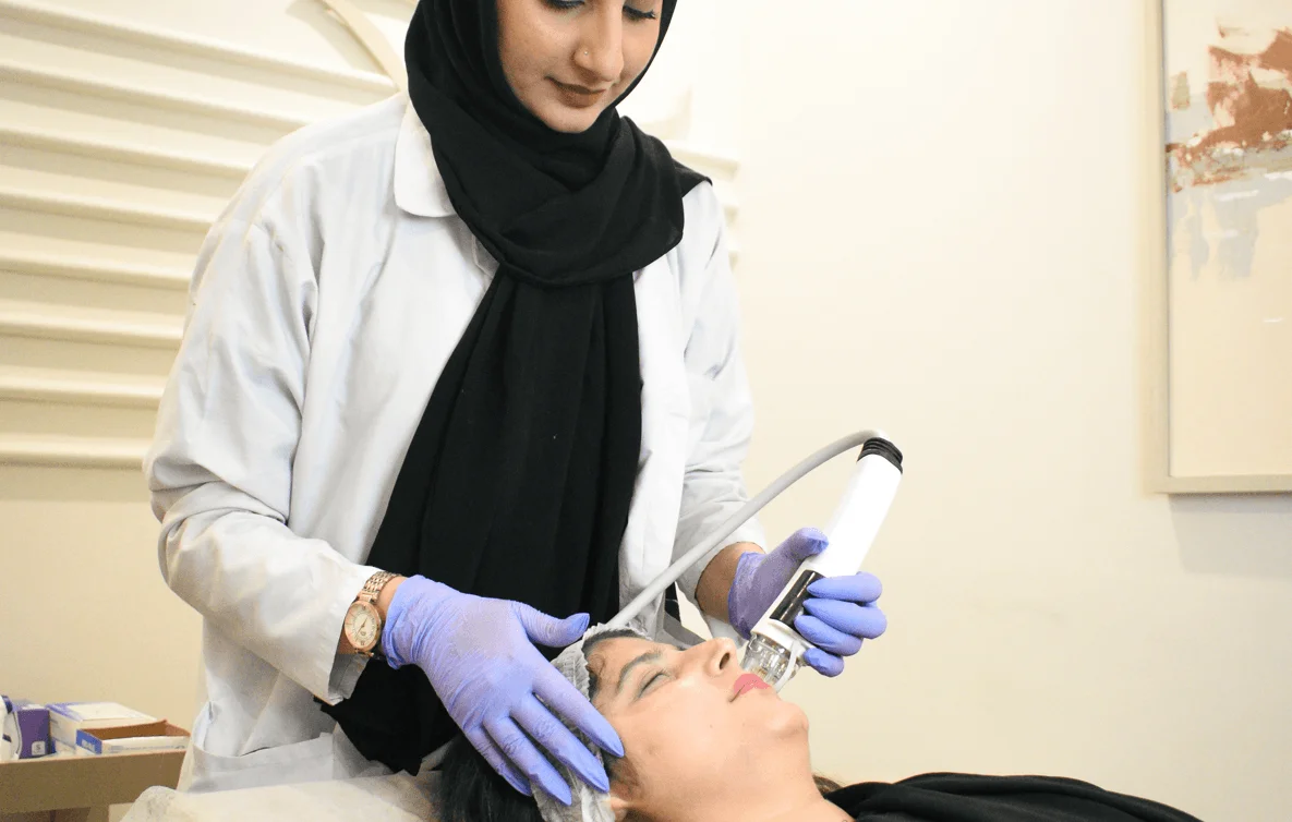 RF microneedling treatment being performed on a woman’s face